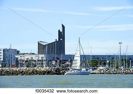 Stock Image - France, Poitou Charentes, Royan, the port and church of Notre Dame. Fotosearch