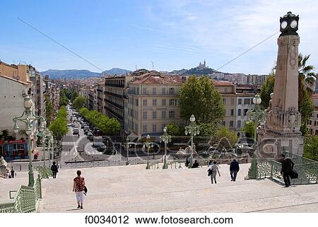 France, Provence, Marseilles, stairs of St Charles and Notre Dame de la Garde in the background View Large Photo Image Stock Image - France, Provence, Marseilles, stairs of St Charles and Notre Dame de la Garde in the background. Fotosearch