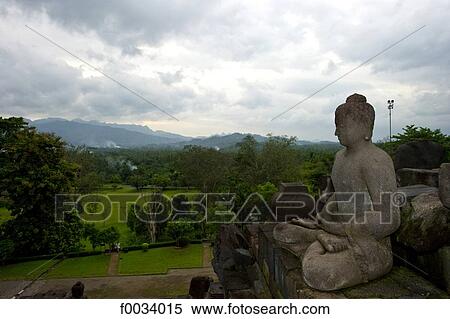 Stock Photography - Indonesia, Java, Borobudur temple, statue of Buddha. Fotosearch