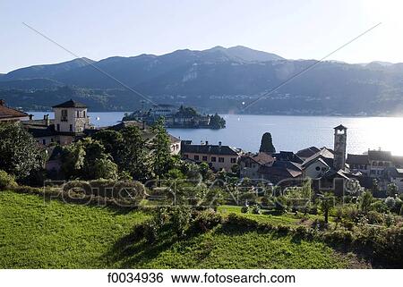 Italy, Piedmont, lake and village of Orta San Giulio View Large Photo Image Stock Photograph - Italy, Piedmont, lake and village of Orta San Giulio. Fotosearch