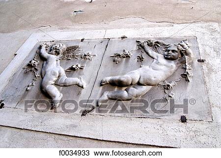Stock Image - Italy, Piedmont, lake Orta, isola San Giulio, sculpted angels. Fotosearch