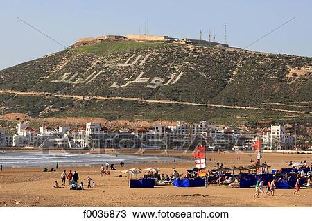Stock Image - Morocco, Agadir, beach with the marina in the background. Fotosearch