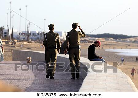 Morocco, Agadir, polecemen on patrol along the beach View Large Photo Image Stock Photography - Morocco, Agadir, polecemen on patrol along the beach. Fotosearch