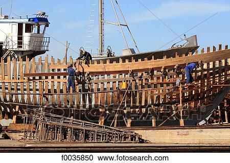 Stock Image - Morocco, Agadir, the port, boats under construction. Fotosearch