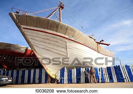 Stock Photo - Morocco, Essaouira, boats under construction. Fotosearch