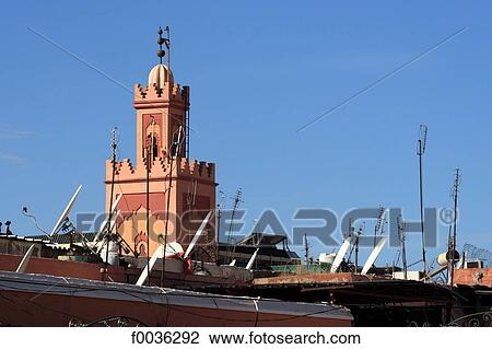 Stock Image - Morocco, Marrakech, minaret and satellite dish. Fotosearch
