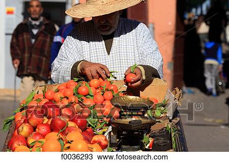 Morocco, Marrakech, souk, seller of oranges and clementines View Large Photo Image Stock Image - Morocco, Marrakech, souk, seller of oranges and clementines. Fotosearch