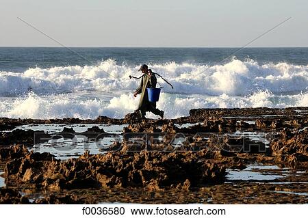Morocco, Tiznit, Aglou beach, fishermen View Large Photo Image Stock Image - Morocco, Tiznit, Aglou beach, fishermen. Fotosearch