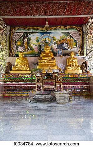 Picture - Thailand, Chiang Mai, Wat Chiang Man temple, golden Buddha. Fotosearch