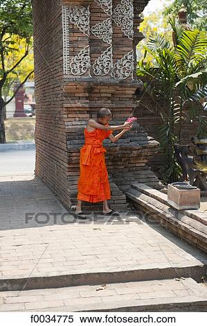 Thailand, Chiang Mai, Wat Lok Moli temple, young monk playing with a water gun View Large Photo Image Stock Photography - Thailand, Chiang Mai, Wat Lok Moli temple, young monk playing with a water gun. Fotosearch