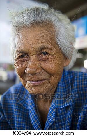 Thailand, in the direction of Bangkok, Maeklong station, in the market, old woman View Large Photo Image Picture - Thailand, in the direction of Bangkok, Maeklong station, in the market, old woman. Fotosearch