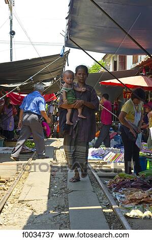 Thailand, in the direction of Bangkok, Maeklong station, in the market View Large Photo Image Stock Photo - Thailand, in the direction of Bangkok, Maeklong station, in the market. Fotosearch