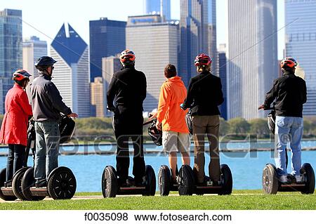 United States, Illinois, Chicago, riders on segways, Michigan lake and buildings View Large Photo Image Stock Photo - United States, Illinois, Chicago, riders on segways, Michigan lake and buildings. Fotosearch
