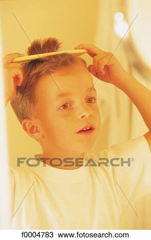 Stock Image - Day of a child, lifestyle, comb, mirror, inside. Fotosearch