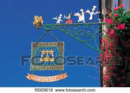 Stock Photo - France, Alsace, Village of Eguishem, shop sign. Fotosearch