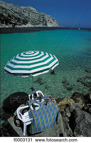 France, Cassis, table on rocky inlet View Large Photo Image Stock Image - France, Cassis, table on rocky inlet. Fotosearch