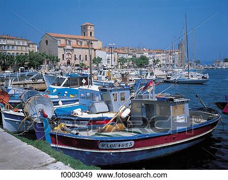 Stock Photo - France, La Ciotat, fishing boats in the harbour. Fotosearch