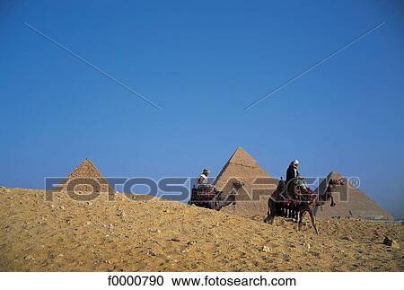 Egyp, Cairo, Pyramids and camel drivers in dunes View Large Photo Image Stock Image - Egyp, Cairo, Pyramids and camel drivers in dunes. Fotosearch
