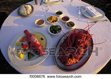 Stock Photograph - Reunion, Table set at the Boucan Canot Hotel. Fotosearch