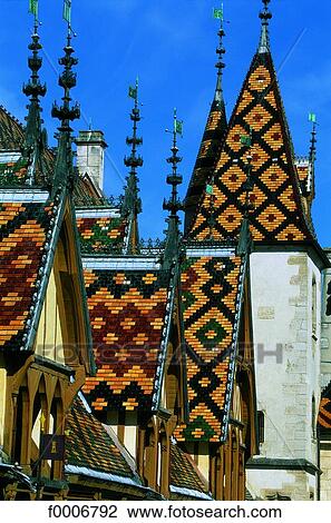 Stock Image - Burgundy, Beaune, General Hospital: tile roofs. Fotosearch