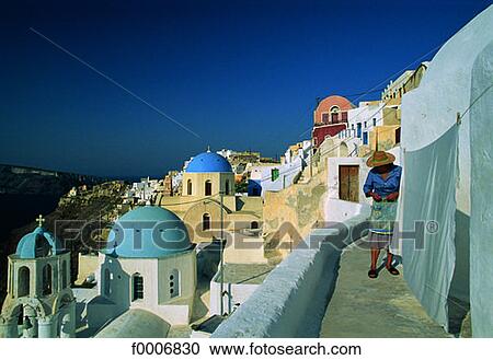 Stock Image - Greece, Santorini, terraces in Ia village. Fotosearch