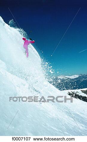 Stock Photo - France, Alps, Megeve, cornice jump on skis. Fotosearch
