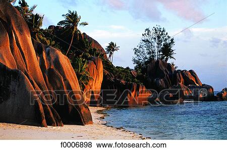 Seychelles, La Digue Island, granite rocks at sunset View Large Photo Image Stock Photo - Seychelles, La Digue Island, granite rocks at sunset. Fotosearch