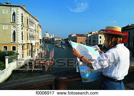 Italy, Venice, Woman looking at a map by the Grand Canal View Large Photo Image Stock Photo - Italy, Venice, Woman looking at a map by the Grand Canal. Fotosearch