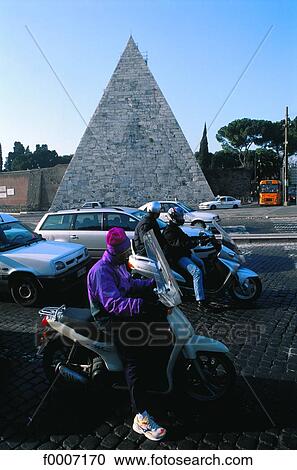 Italy, Rome, Traffic in front of the Cestius pyramid View Large Photo Image Stock Image - Italy, Rome, Traffic in front of the Cestius pyramid. Fotosearch