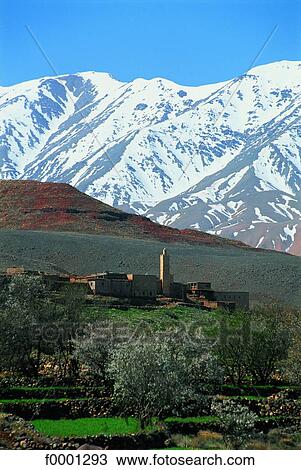 Stock Image - Morocco, Ouarzazate province, Berber village and the Atlas mountains. Fotosearch