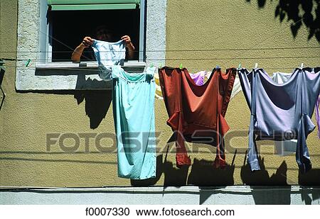 Portugal, Lisbon, Clothes drying at window View Large Photo Image Stock Image - Portugal, Lisbon, Clothes drying at window. Fotosearch