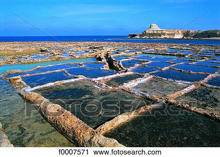 Malta, Gozo, salt marshes dug in rock View Large Photo Image Stock Image - Malta, Gozo, salt marshes dug in rock . Fotosearch