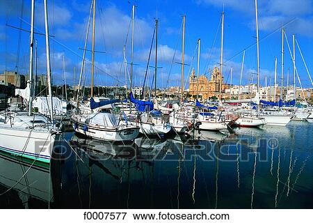 Stock Photo - Malta, Msida harbour and St Joseph church in background. Fotosearch