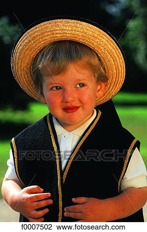 Stock Image - France, Brittany, Boy wearing traditional costume. Fotosearch