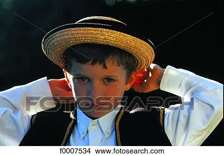 Picture - France, Brittany, Dinan, boy wearing traditional costume. Fotosearch