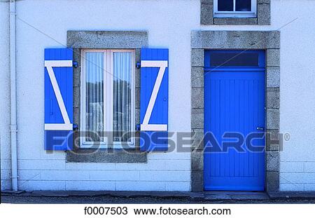 Stock Image - France, Brittany, Front of traditional home. Fotosearch