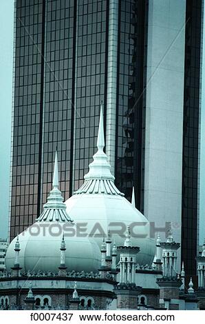 Stock Photo - Malaisia, Kuala Lumpur, domes of mosk by buildings. Fotosearch