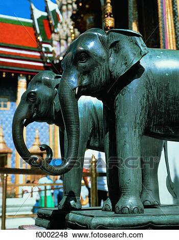 Stock Photo - Thailand, Bangkok, bronze elephants in front of Royal Palace. Fotosearch