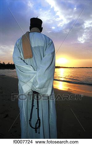 Senegal, man looking at sunset View Large Photo Image Picture - Senegal, man looking at sunset. Fotosearch