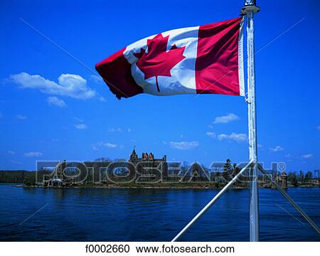 Stock Image - Ontario, St Laurent River and Canadian flag. Fotosearch