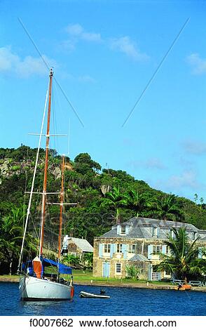 Stock Image - Antigua, Port-of-English and sailboat. Fotosearch