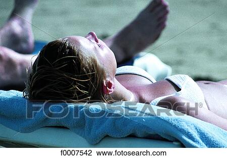Stock Image - Dominican Republic, woman sunba thing. Fotosearch