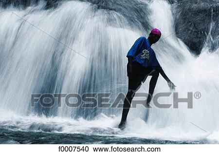Jamaica, man near cascade View Large Photo Image Stock Image - Jamaica, man near cascade. Fotosearch