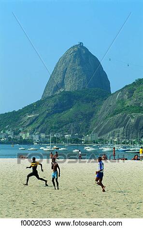 Brazil, Rio de Janeiro, children playing football on beach View Large Photo Image Stock Image - Brazil, Rio de Janeiro, children playing football on beach. Fotosearch
