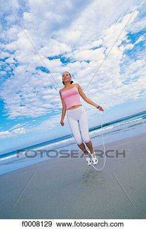 Stock Photo - Sports in the sun, lifestyle, woman, girl, women. Fotosearch