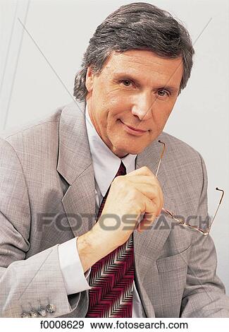 Stock Photo - Portraits, lifestyle, businessman, businessmen, office. Fotosearch