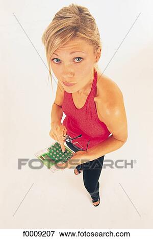 Stock Photo - Studio attitudes, lifestyle, adults, inside. Fotosearch