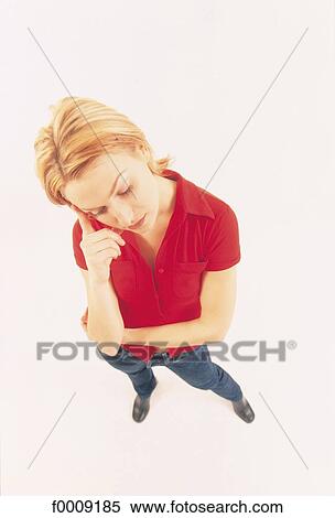 Stock Photography - Studio attitudes, lifestyle, ear, tiredness, tired. Fotosearch