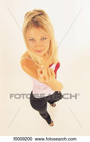 Stock Image - Studio attitudes, lifestyle, sign, adults. Fotosearch