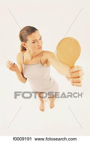 Stock Image - Studio attitudes, lifestyle, high-angle-view, gaze, gazing. Fotosearch